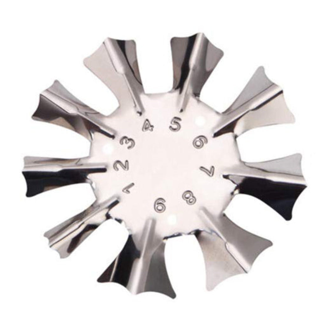A metallic silver star-shaped perfect french smile line nail tool with ten radiating points and engraved numbers 1 through 9 inside, shown on a plain white background.