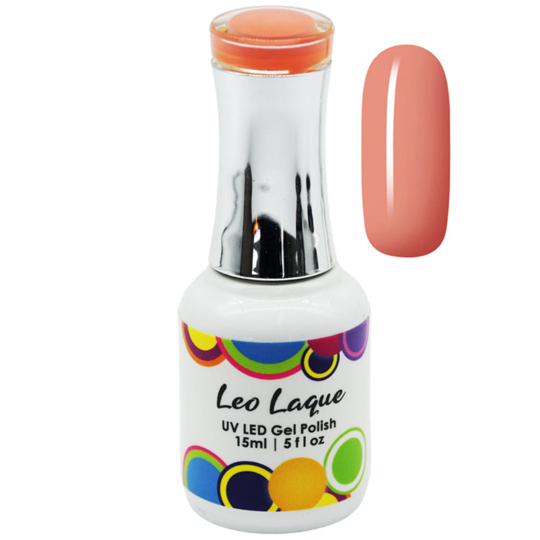 A bottle of Leo Laque UV LED gel polish with a metallic silver neck and a white label featuring colorful circular patterns. The bottle is shown next to a vertical swatch of the coral pink gel polish itself, set against a plain white background.