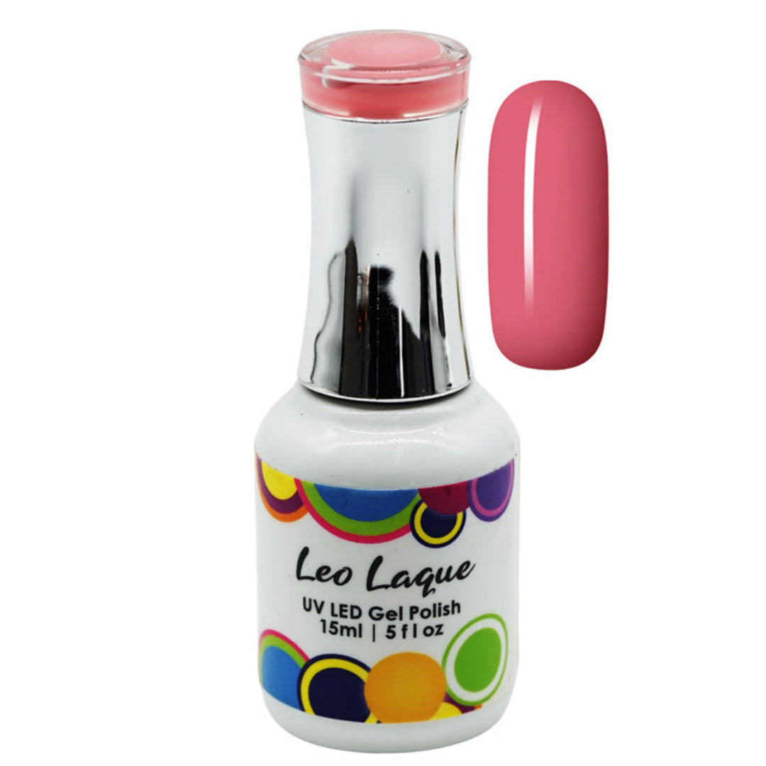 A bottle of Leo Laque UV LED gel nail polish with a silver cap and a white label featuring colorful polka dots, shown next to a vertical swatch of the pink polish on a white background.