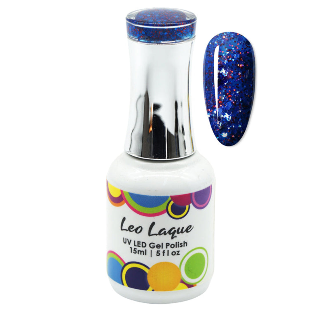 A bottle of Leo Laque UV LED gel nail polish with a silver cap and a white label, shown next to a nail swatch displaying a deep blue glitter polish with red and white flecks.