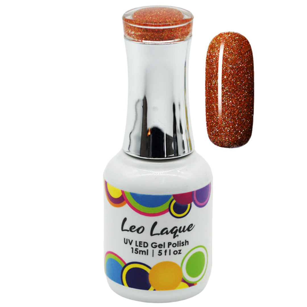A bottle of Leo Laque UV LED Gel Polish with a silver neck and a white base, shown next to a nail swatch displaying the glittery copper-orange polish color.