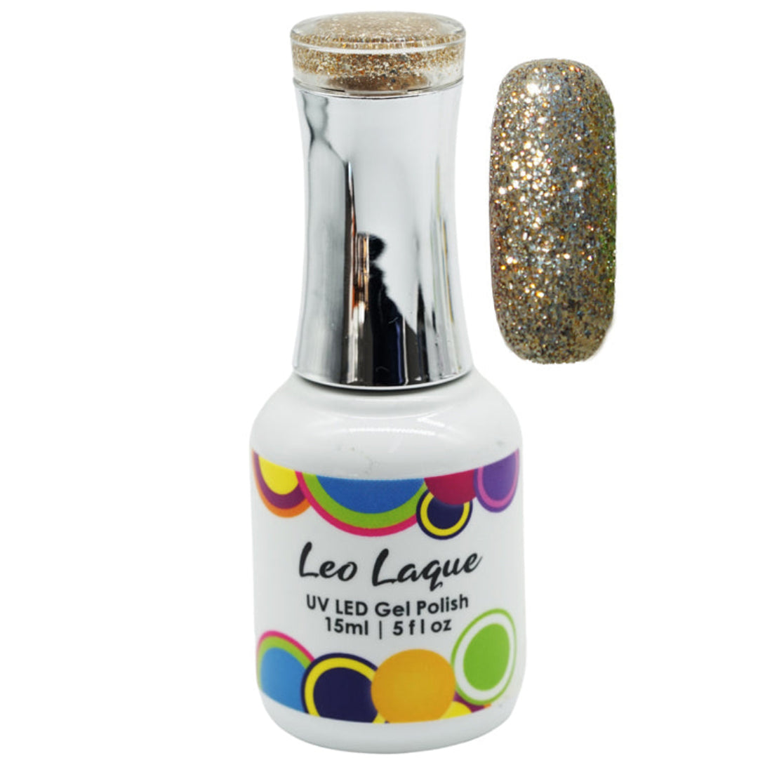 A bottle of Leo Laque UV LED gel nail polish with a silver cap and a color swatch showing a sparkling gold glitter finish, set against a plain white background.