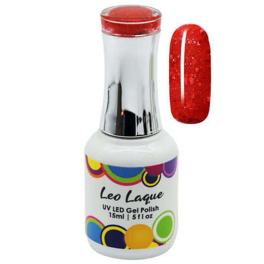 A bottle of Leo Laque UV LED gel polish with a silver cap and a white label featuring colorful circles, shown next to a vertical nail swatch displaying a sparkling red glitter finish.