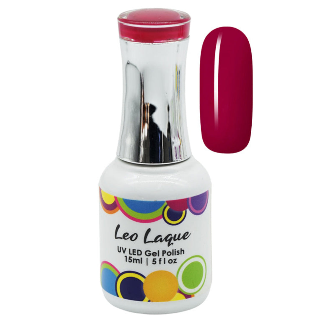 A bottle of Leo Laque UV LED gel polish with a silver cap and a white label, shown next to a vertical swatch of the deep berry pink polish color on a white background.