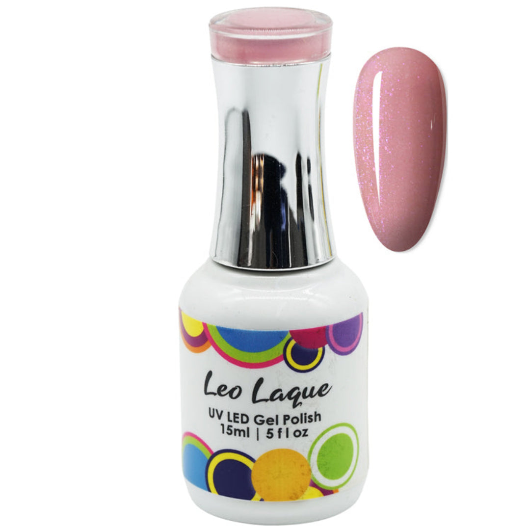 A bottle of Leo Laque UV LED gel nail polish in a light pink shade with fine glitter, shown alongside a matching pink glitter nail tip swatch on a white background.