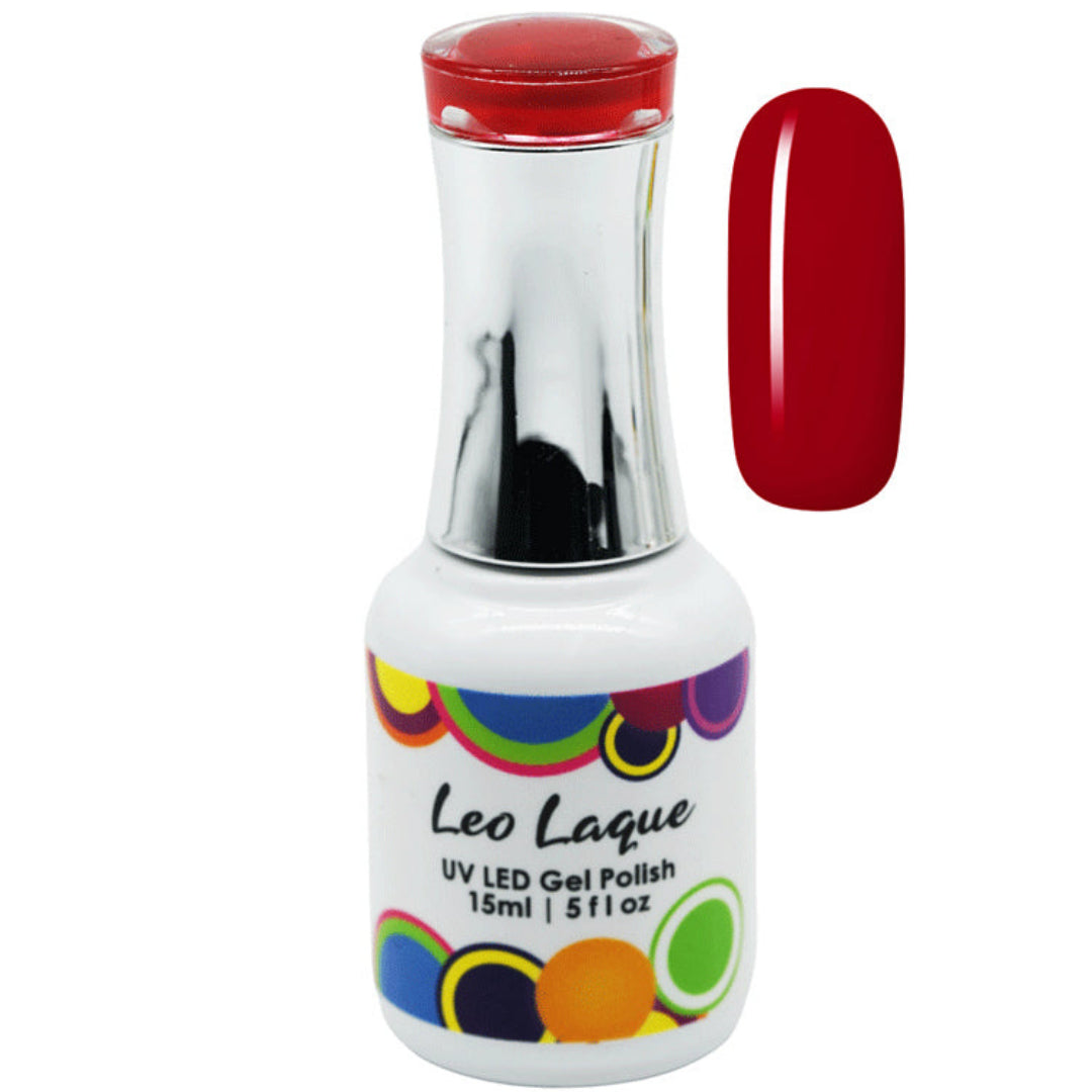 A bottle of Leo Laque UV LED gel nail polish with a white body, colorful circular pattern on the label, and a metallic silver neck, shown next to a vertical swatch of the deep red polish.