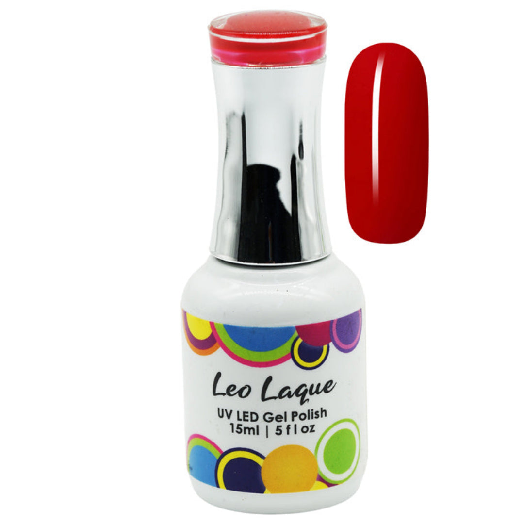 A bottle of Leo Laque UV LED gel nail polish with a white label and colorful circular accents, shown next to a glossy red nail swatch on a plain white background.