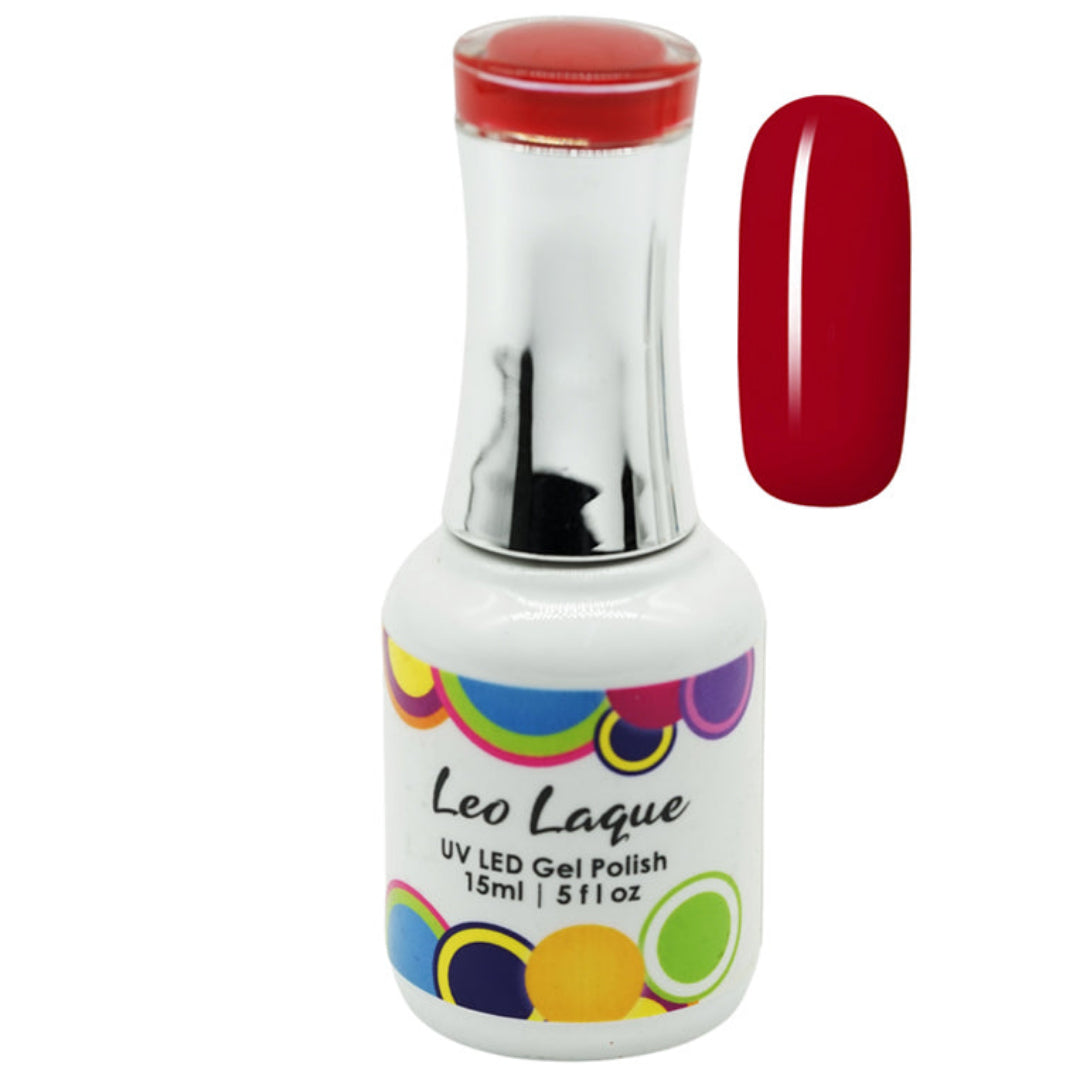 A bottle of Leo Laque UV LED gel nail polish with a white label, colorful polka dots, and a red cap, shown next to a vertical swatch of the deep red polish color on a white background.