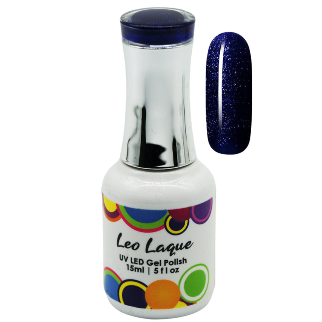 A bottle of Leo Laque UV LED Gel Nail Polish in a deep glittery navy blue shade, shown alongside a vertical nail swatch displaying the sparkling blue color.