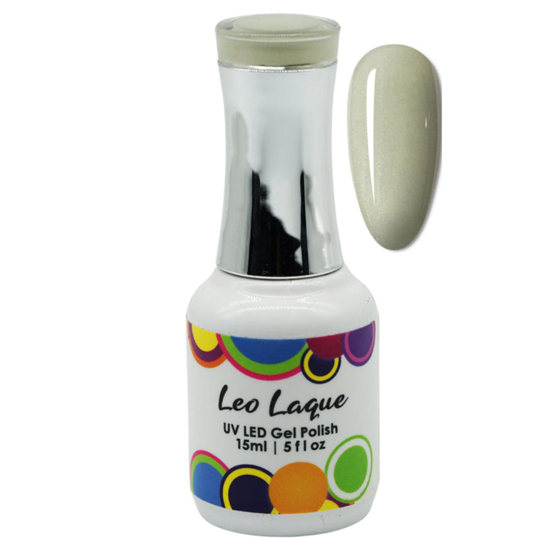 A bottle of Leo Laque UV LED Gel Polish with a metallic silver neck and a white label featuring colorful circular patterns. A vertical swatch of the pale, shimmering beige-green gel polish is shown next to the bottle on a plain white background.