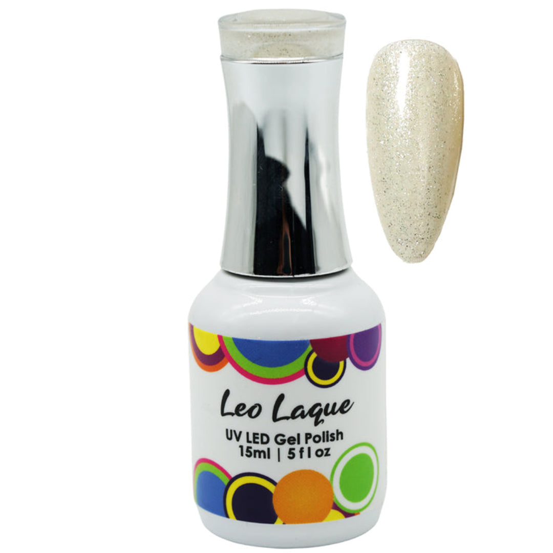A bottle of Leo Laque UV LED gel nail polish in a light white base with golden glitter shade, shown alongside a matching oval nail color swatch on a plain white background.