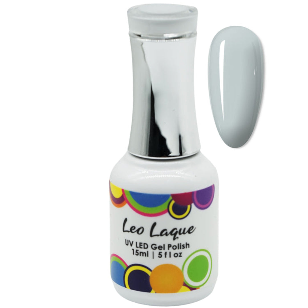 A bottle of Leo Laque UV LED Gel Polish with a silver cap and a white label featuring colorful dots, shown next to a glossy swatch of the light gray polish on a white background.