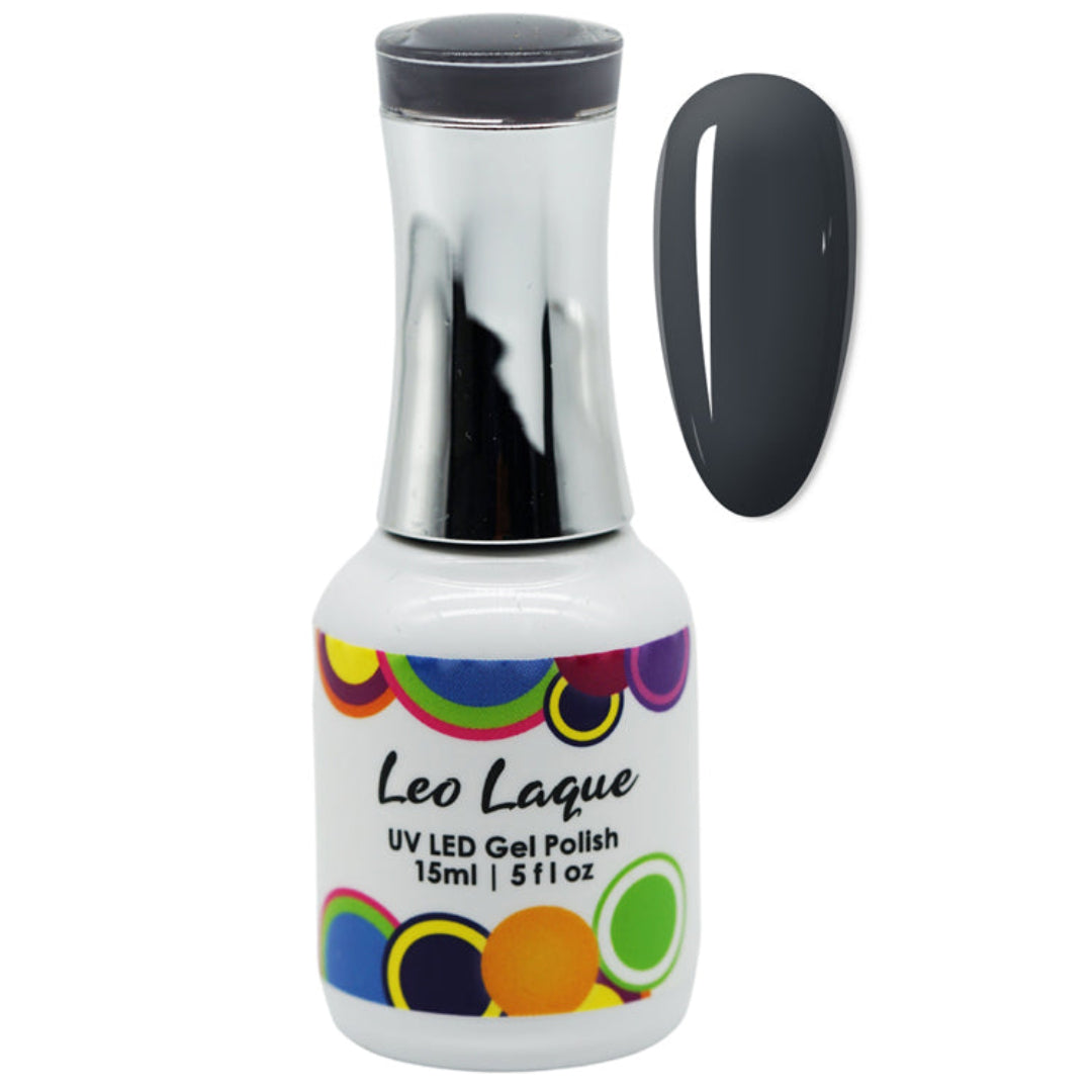 A bottle of Leo Laque UV LED Gel Polish with a metallic silver cap and a white label featuring colorful circles, shown next to a dark gray nail swatch on a white background.