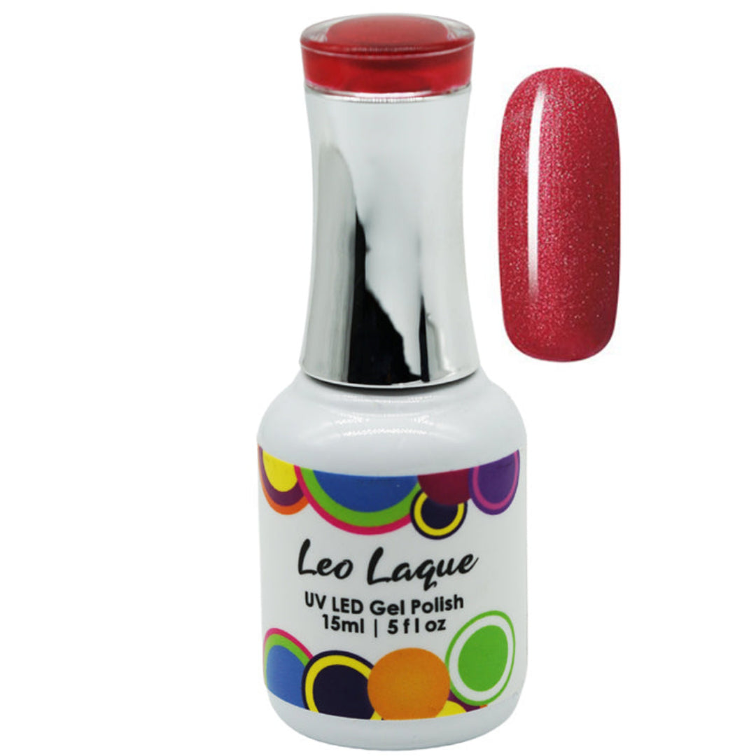 A bottle of Leo Laque UV LED gel nail polish with a white label and colorful circular accents, shown next to a vertical swatch of the glittery red polish on a white background.