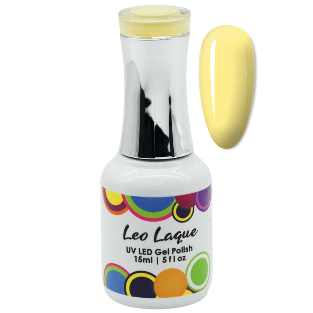 A bottle of Leo Laque UV LED Gel Polish in a pale yellow shade, shown next to a matching yellow nail swatch on a plain white background.