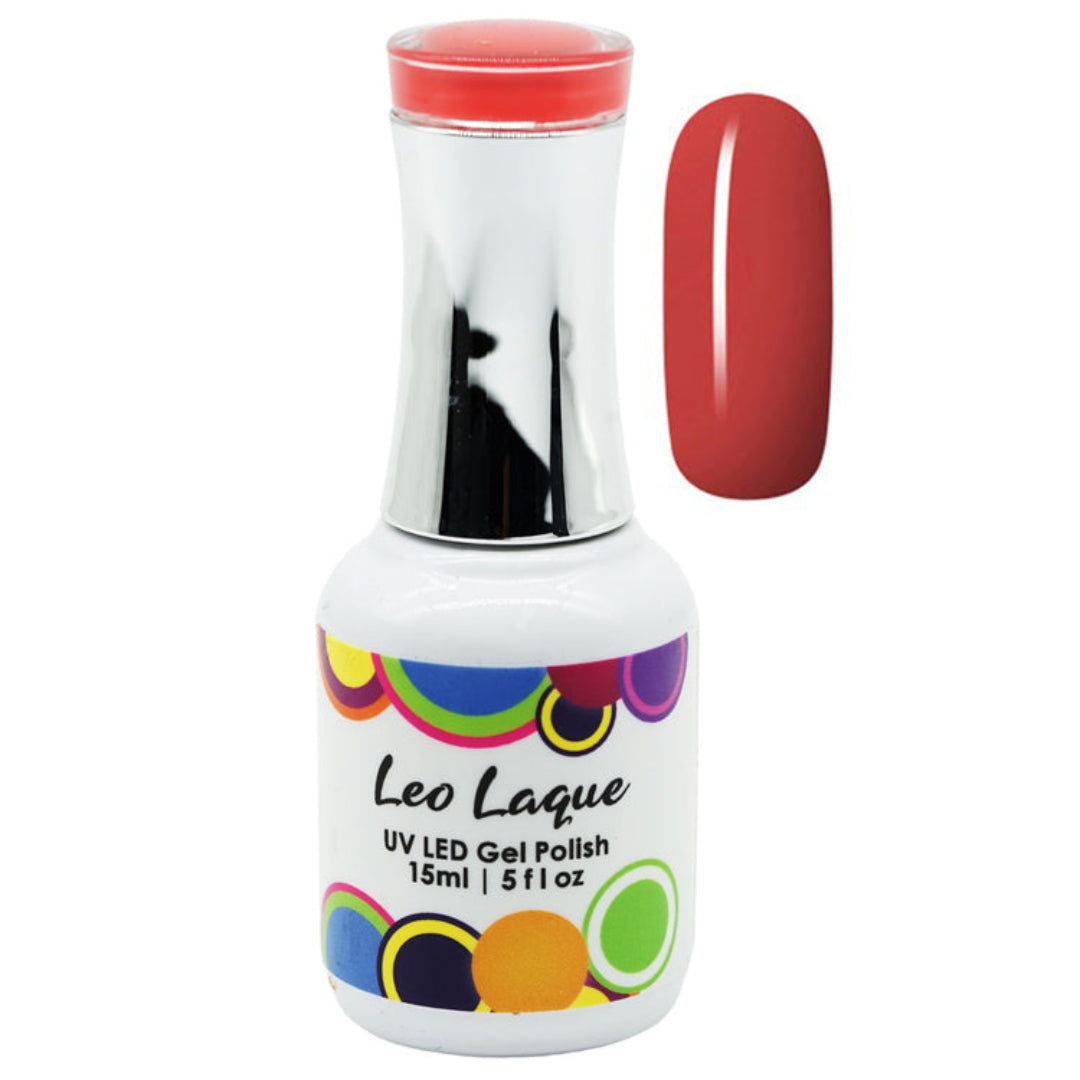 A bottle of Leo Laque UV LED Gel Polish with a white label and colorful circular accents, shown next to a glossy swatch of the coral-red polish color on a white background.