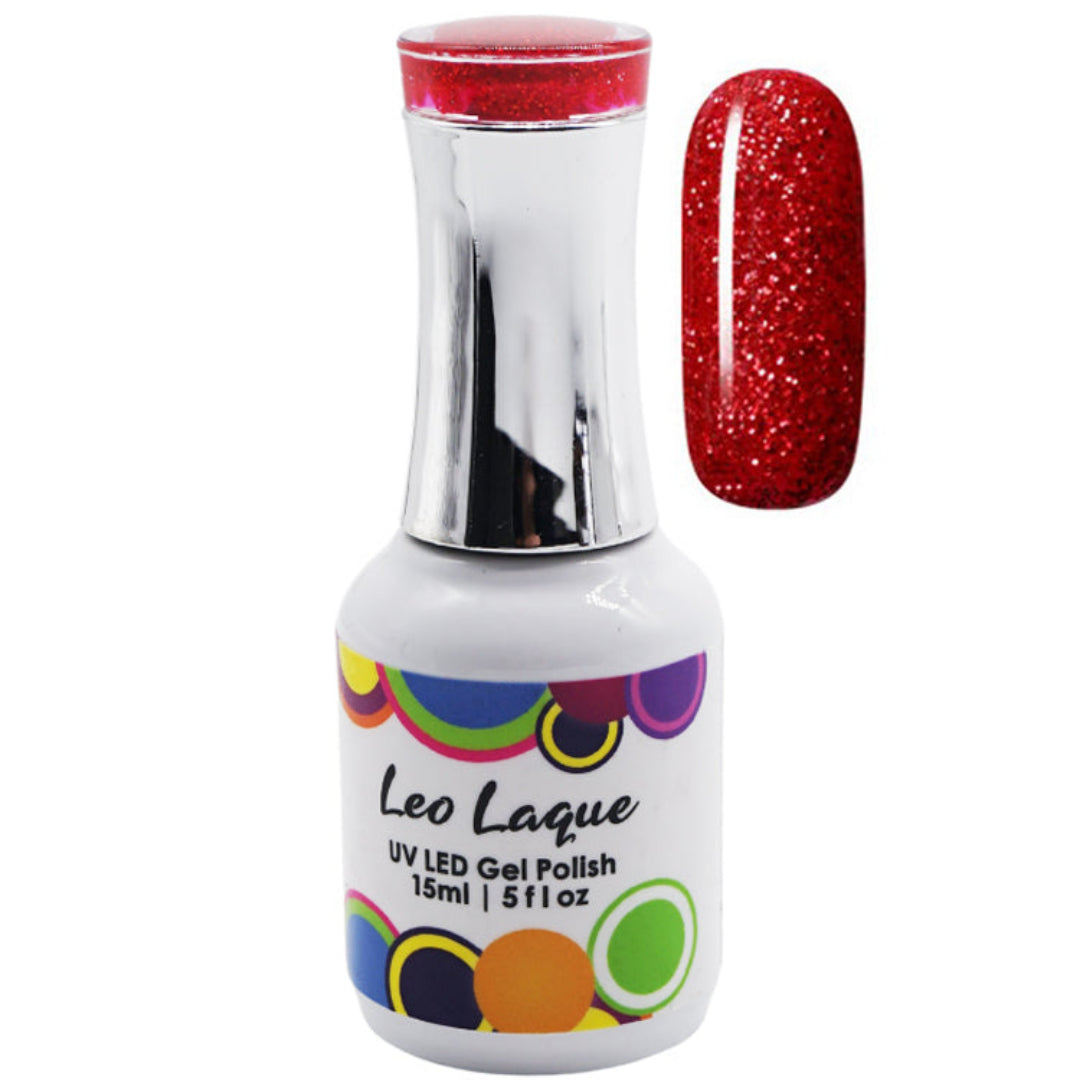 A bottle of Leo Laque UV LED gel polish with a silver cap and a white label, shown next to a nail swatch displaying a sparkling red glitter finish.