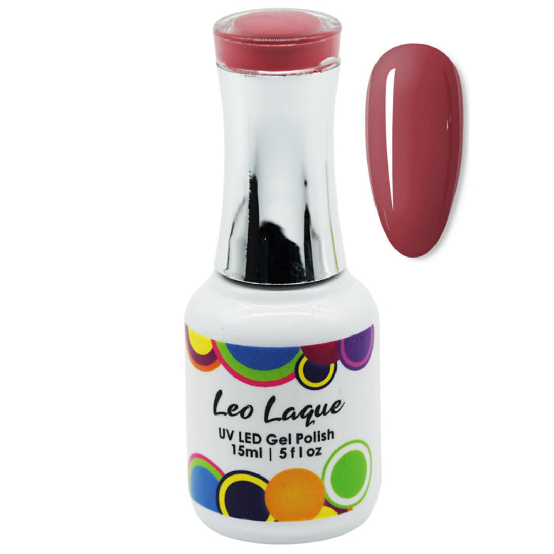 A bottle of Leo Laque UV LED gel polish with a white label and colorful circular accents, shown next to a glossy swatch of the deep berry-red polish color on a white background.