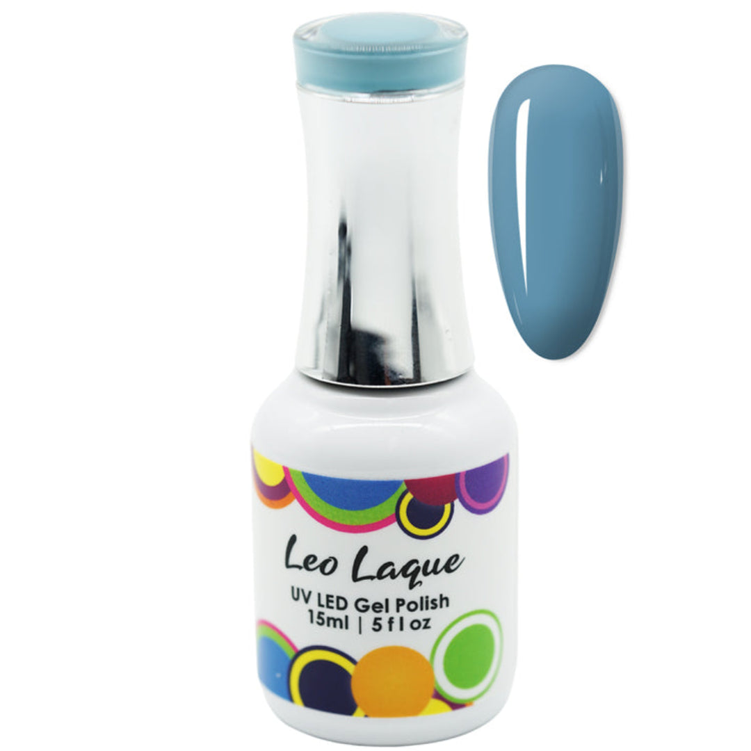 A bottle of Leo Laque UV LED Gel Polish in a dusty blue shade, shown alongside a matching blue nail swatch on a plain white background.