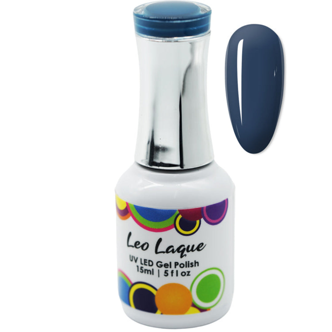 A bottle of Leo Laque UV LED Gel Polish with a metallic silver neck and a blue cap, shown next to a vertical oval swatch displaying the deep navy blue polish color.