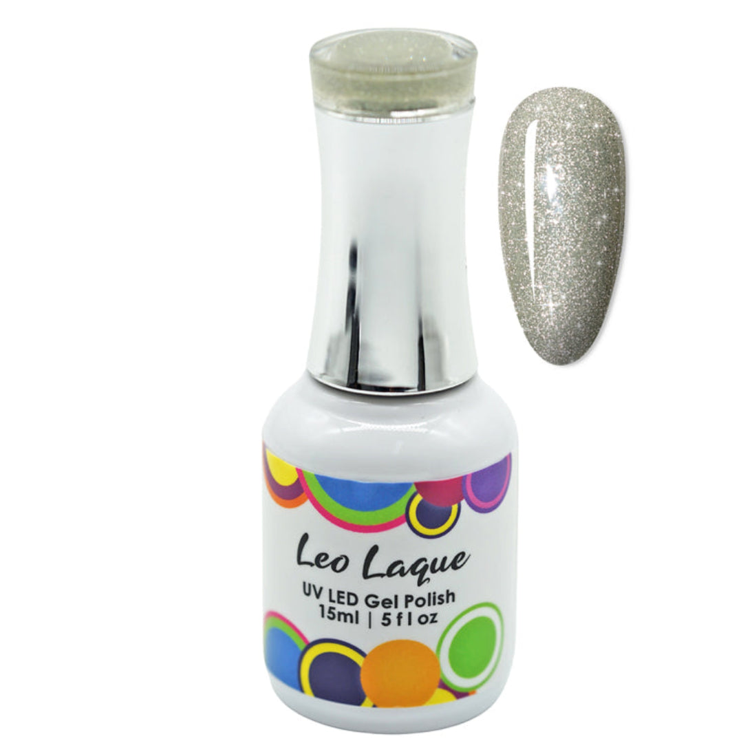 A bottle of Leo Laque UV LED gel polish with a silver glitter polish, shown next to a nail swatch displaying the glittery silver finish.
