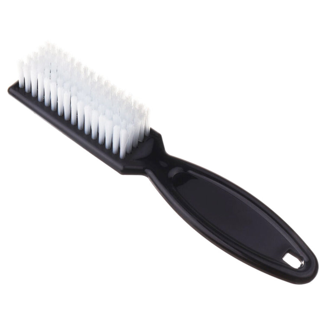P016 Black Cuticle Nail Brush with Handle | A black plastic nail brush with white bristles, for cleaning cuticles, nails and remove filing dust from nails, shown diagonally on a plain white background.
