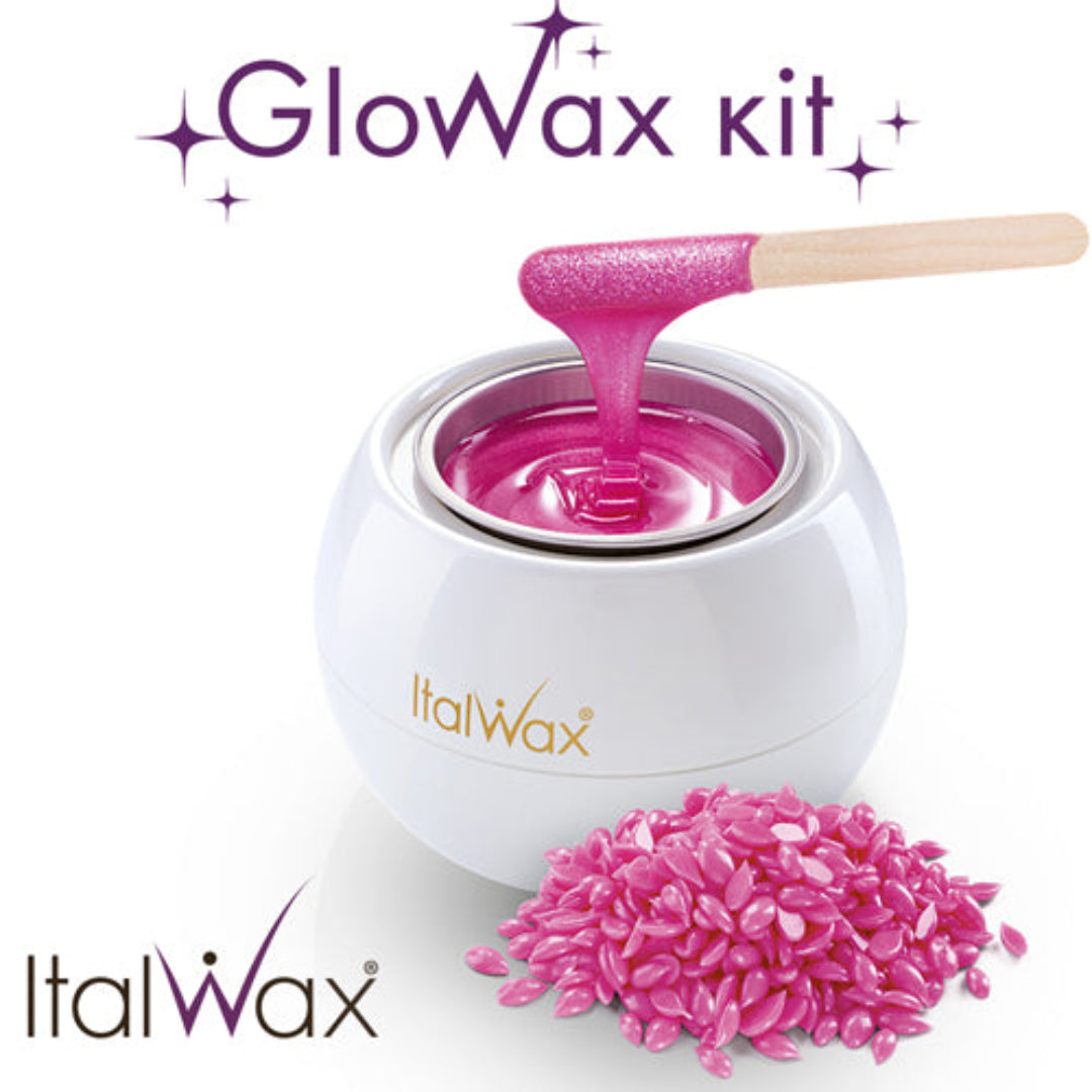 W399 Italwax Glowax Kit | Italwax Glowax white small round wax heater / warmer with cherry pink wax, for face waxing, a spatula with pink wax dripping in pot and pink pearl wax beads in the foreground