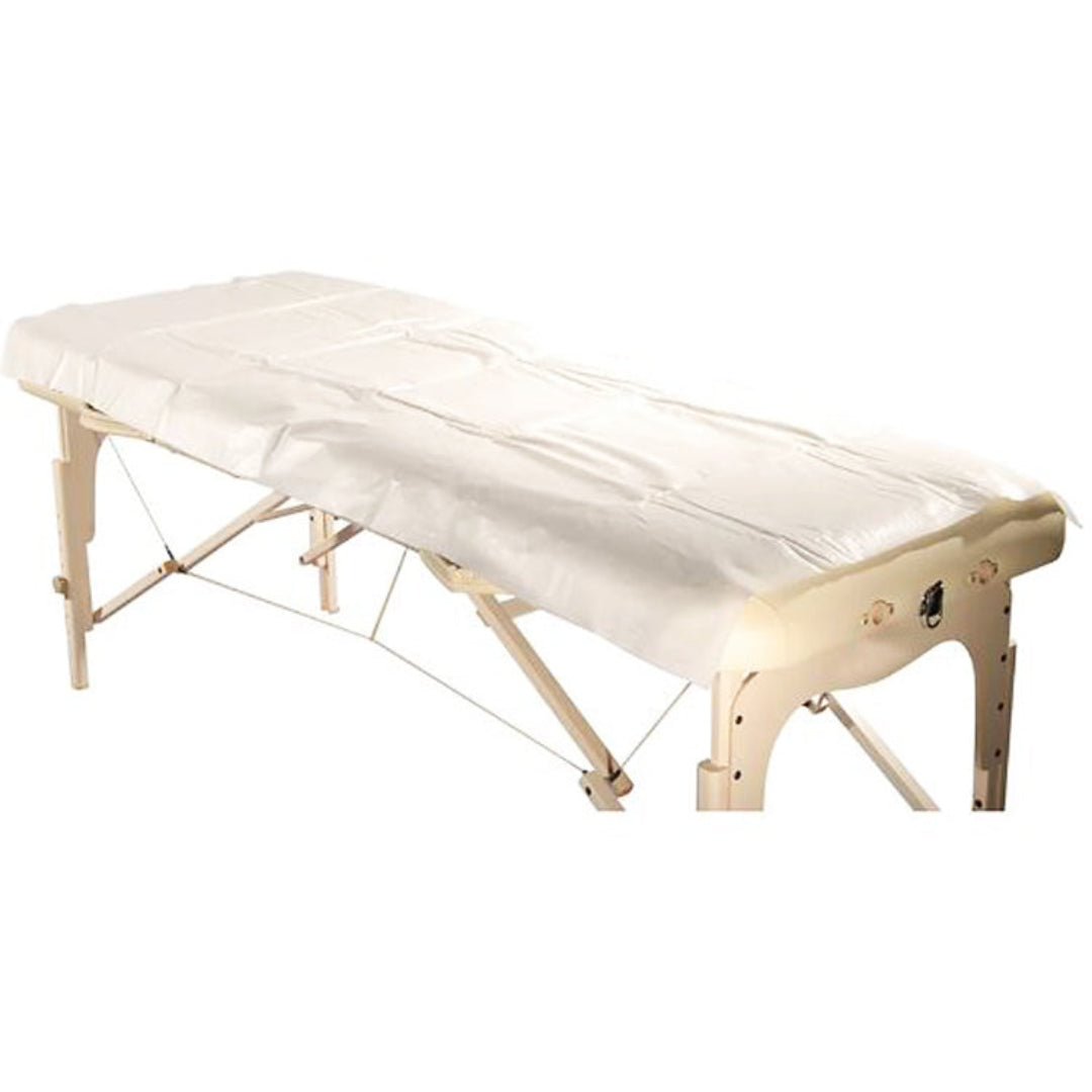 Disposable Waterproof Bed Sheet packed in 10's | A white disposable bed sheet, with paper on one side and plastic on the other to prevent spillages or oil penetrating on bed